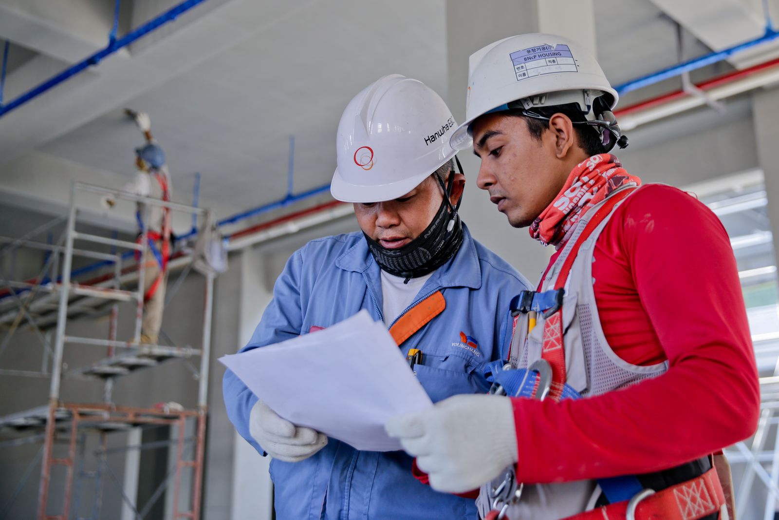 Tank cleaning technicians reviewing a job plan for American Vacuum in Morgan City, LA
